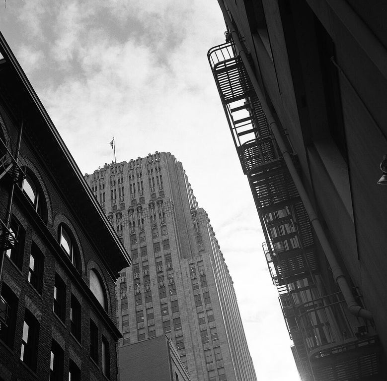 a photo taken from downtown San Francisco, looking through buildings up to the sky. shot with a VoigtlÃ¤nder Perkeo, Tmax 400